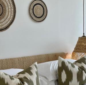a bedroom with a bed with two pillows on it at Harbour View House in St Ives