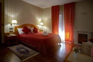 Postel nebo postele na pokoji v ubytování Hotel Lory & Ristorante Ferraro