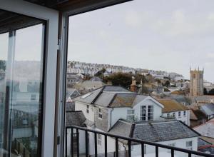 a view of a city from a window at Harbour View House in St Ives