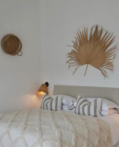a bed with a bird sitting on top of it at Harbour View House in St Ives
