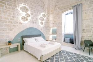 Posteľ alebo postele v izbe v ubytovaní Palazzo Vico Bianco Raro Villas Homes Collection