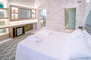 Posteľ alebo postele v izbe v ubytovaní Palazzo Vico Bianco Raro Villas Homes Collection