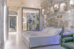 Posteľ alebo postele v izbe v ubytovaní Palazzo Vico Bianco Raro Villas Homes Collection
