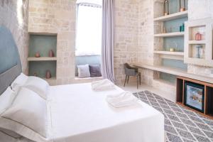 Posteľ alebo postele v izbe v ubytovaní Palazzo Vico Bianco Raro Villas Homes Collection