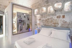 Posteľ alebo postele v izbe v ubytovaní Palazzo Vico Bianco Raro Villas Homes Collection