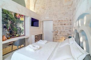 Posteľ alebo postele v izbe v ubytovaní Palazzo Vico Bianco Raro Villas Homes Collection