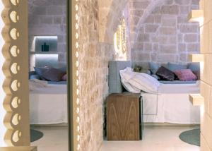 Posteľ alebo postele v izbe v ubytovaní Palazzo Vico Bianco Raro Villas Homes Collection