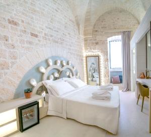 Posteľ alebo postele v izbe v ubytovaní Palazzo Vico Bianco Raro Villas Homes Collection