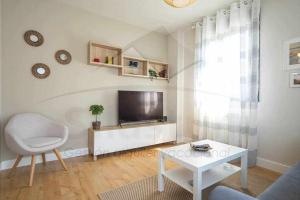 TV a/nebo společenská místnost v ubytování Jovial Estación Apartamento