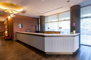 The lobby or reception area at Ramada Plaza by Wyndham Milano