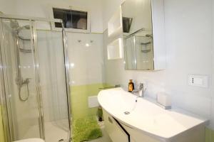 a bathroom with a sink and a shower at Villa Lata in Marina San Gregorio