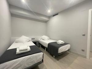 Кровать или кровати в номере Apartaments Voramar Roses