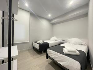 Кровать или кровати в номере Apartaments Voramar Roses