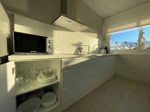Кухня или мини-кухня в Apartaments Voramar Roses
