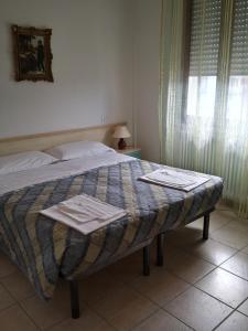 Ліжко або ліжка в номері Residence lido adriano