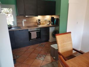 a kitchen with a sink and a stove top oven at adBs Ferienhaus in Winterberg