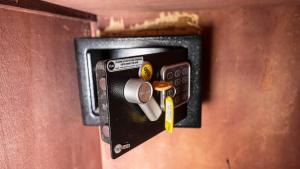 a lock on a wooden door with a knob at GOLF VIEW RESIDENCE_STUDIO in Yaoundé