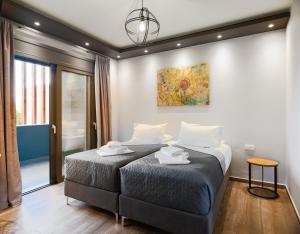 Кровать или кровати в номере Filia's Memories Apartments