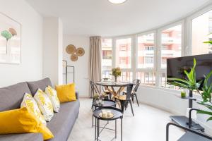 Televízia a/alebo spoločenská miestnosť v ubytovaní Malaga Centro