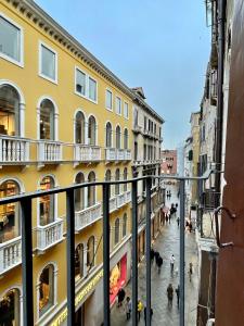 a view from a balcony of a street with buildings at Studio di Lilli in Venice +18 photos