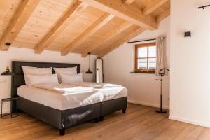 Un pat sau paturi într-o cameră la Alpenblüte