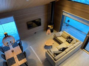 an overhead view of a living room with a pool at Villa Primus in Ruka