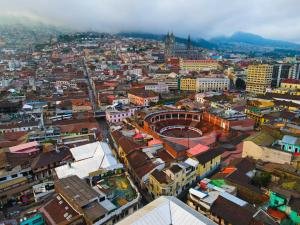 an aerial view of a city with buildings at Vibes Aurik in Quito