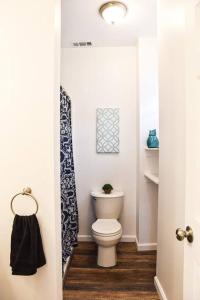 a bathroom with a white toilet in a room at Beautiful Pittsburgh home-walkable area w parking in Pittsburgh