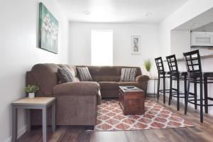 a living room with a couch and a table at Perfect Mount Washington Home Walkable w Parking in Pittsburgh