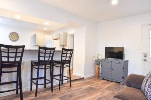 a living room with chairs and a table and a tv at Perfect Mount Washington Home Walkable w Parking in Pittsburgh