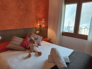 A bed or beds in a room at Apartaments Arenys De Boi