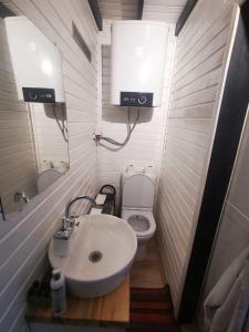 a small bathroom with a sink and a toilet at İstanbul Airport Bungalow With Terrace in Arnavutköy