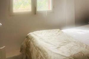 a bed in a bedroom with a window at La Gardana, casa de campo mallorquina in Porreres +71 photos