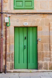 a blue door leading to a green room at Dúplex Camino de Santiago I, II y III, Rúa Real 26 y 28, Zona Monumental, Pontevedra in Pontevedra