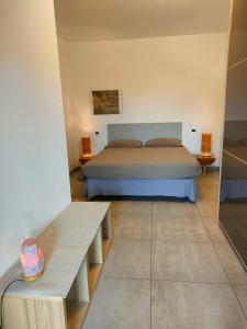 a bedroom with a bed and two tables in it at ,,,a casa di Martina in Mestre