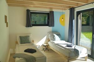 A bed or beds in a room at Wäller Haus - Modern villa with fireplace & large natural garden