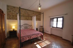 Postel nebo postele na pokoji v ubytování Agriturismo Ragoncino