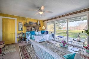 a living room with a bed and a window at Peaceful Maine Home with Patio Ocean Inlet Getaway! in Bath