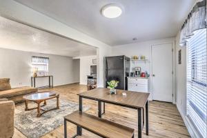 a living room with a table and a couch at Bright 2-Story Condo 8 Mi to Grindstone Lake in Ruidoso Downs