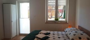 Posteľ alebo postele v izbe v ubytovaní Apartament Green Forest