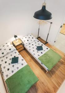 Posteľ alebo postele v izbe v ubytovaní Apartament Green Forest