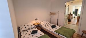 Posteľ alebo postele v izbe v ubytovaní Apartament Green Forest