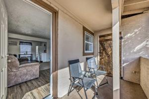 two views of a living room with a couch and chair at Dirty Daves Cabin Studio in Ruidoso Downs! in Ruidoso Downs