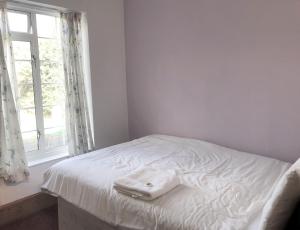 Postel nebo postele na pokoji v ubytování Lyttleton Guest House Limited