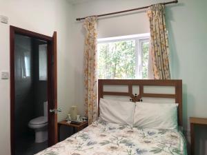 Postel nebo postele na pokoji v ubytování Lyttleton Guest House Limited