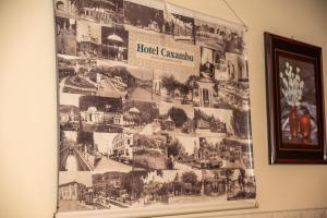 a poster on the wall of a hotel room at VOA Hotel Caxambu in Caxambu