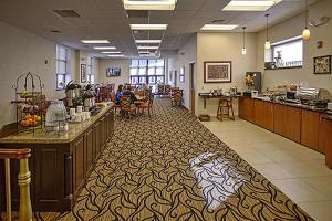 a lobby of a store with a counter and a restaurant at The Hotel Warner in West Chester