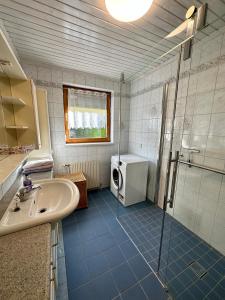 a bathroom with a sink and a shower at AJO Vienna Ambassador Family House with Free Parking in Vienna