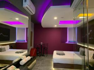 Postel nebo postele na pokoji v ubytování Roxy Motel