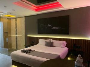 Postel nebo postele na pokoji v ubytování Roxy Motel